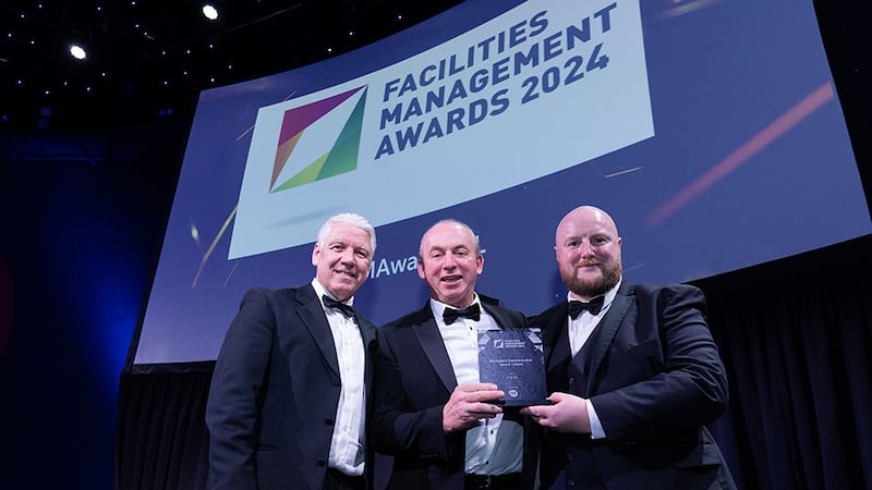 Eric Doyle, managing director of ISS Ireland Ltd, presents the workspace transformation award – client award to Trevor O'Brien and Nick Ryan, O'Brien Facilities