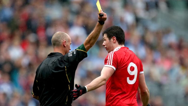 Seán Cavanagh gets his yellow card Photograph: Ryan Byrne/INPHO