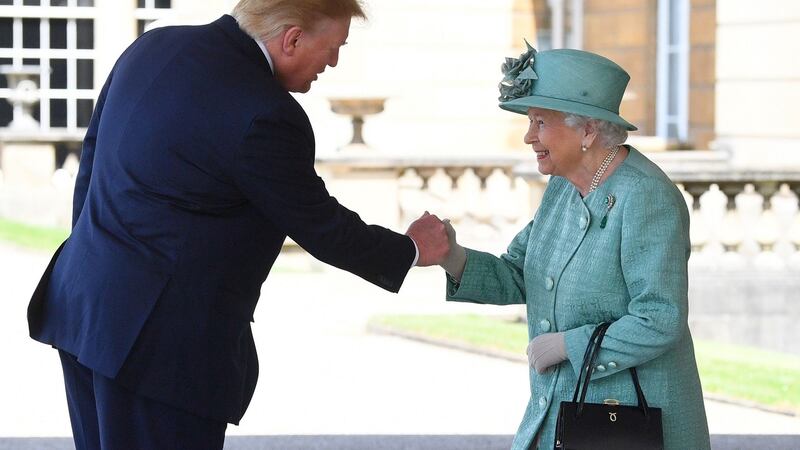 Queen Elizabeth II shakes hands with US president Donald Trump during a welcome ceremony at Buckingham Palace in central London. Photograph: Victoria Jones/AFP/Getty Images