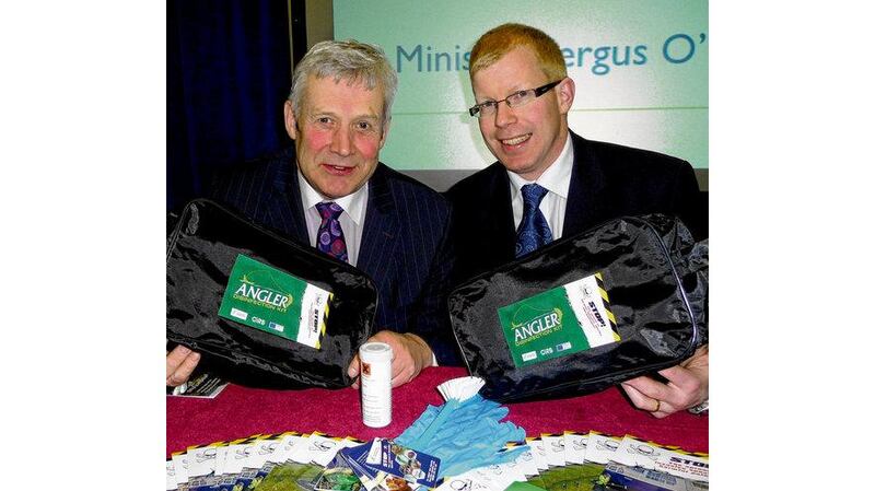 Minister of State Fergus O'Dowd and Ciaran Byrne, CEO of Inland Fisheries Ireland, launch the Angler Disinfection Kit at the Angling Expo Show in Swords, Co Dublin