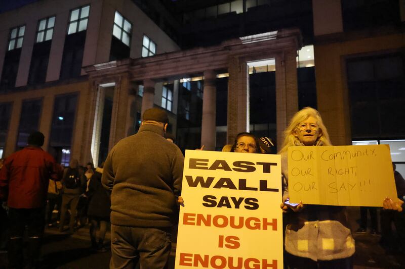 People attend a protest outside a former ESB office being used to house asylum seekers in East Wall, Dublin, which blocked roads in the area on November 21st. Photograph: Dara Mac Dónaill/The Irish Times