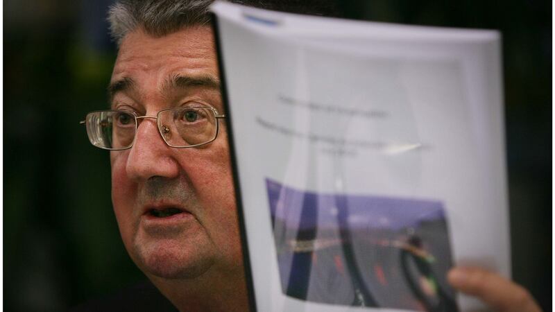 Archbishop Diarmuid Martin holds a copy of the report on sexual abuse. Photograph: Bryan O’Brien/The Irish Times