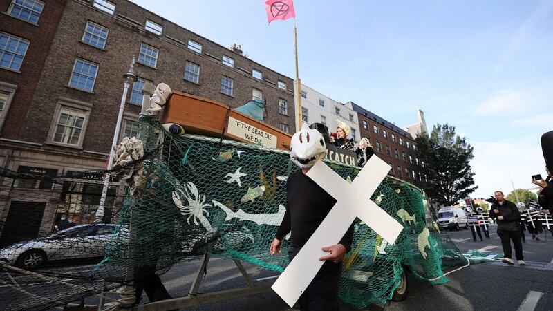 Protesters drag  a fish trawler through Dublin city centre calling for better protection for Ireland’s oceans and marine life.  Photograph:  Nick Bradshaw