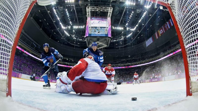 Finland’s Teemu Selanne (left) scores against Russia’s goalie Semyon Varlamov during the first period of their men’s quarter-final at the Sochi 2014 Winter OlympicsPhotograph: Martin Rose/Reuters