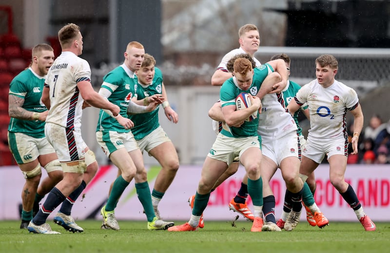 Ireland's Ciaran Frawley is tackled. Photograph: Dan Sheridan/Inpho