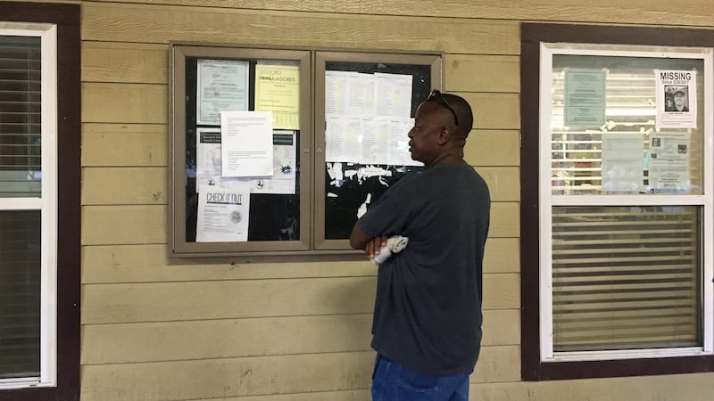 A man inspects list of names outside Plano Day Labour Centre in Dallas, where workers gather early each morning to seek employment. Photograph: Suzanne Lynch