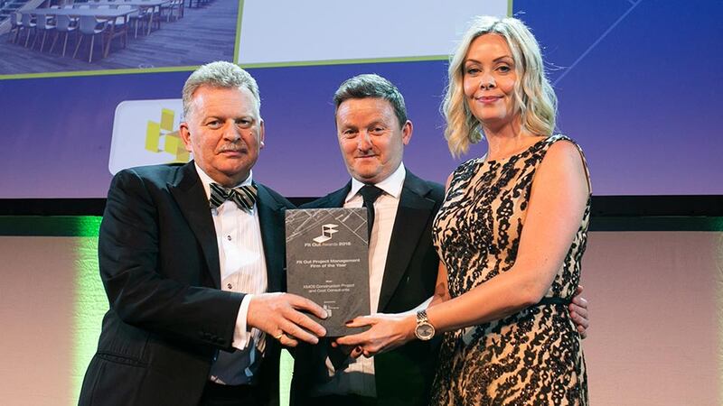 Trevor Schwer, Managing Director, The Interiors Group presents the Fit Out Project Management Firm of the Year award to Fiona Mullally & Nigel Spence, KMCS Construction Project and Cost Consultant