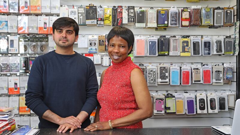 Mohammed Khan and Esther Beakare at L&J a phone, hair and cosmetics shop in Edgeworthstown. Photo: Lorraine Teevan