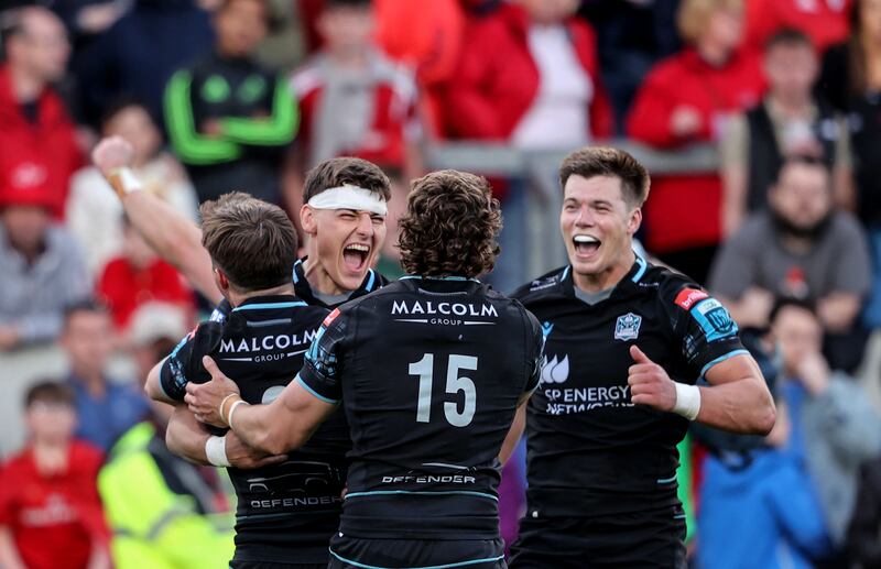 Glasgow Warriors' Tom Jordan, Josh McKay and Huw Jones celebrate at Thomond Park. Photograph: Dan Sheridan/Inpho