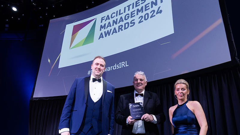 Ross Macmahon, managing director of BaileyHygiene, presents the client & service provider partnership of the year award to Fergus Keanne and Ailsa Tuomey, Salesforce Partnership with Acacia