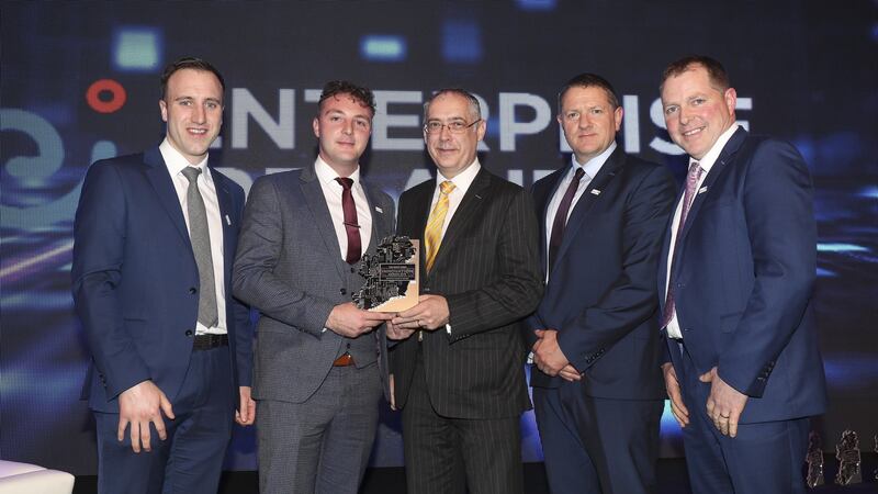 The team from PEL Waste Management accepting the award for Manufacturing and Design innovation of the year from Gearoid Mooney of Enterprise Ireland