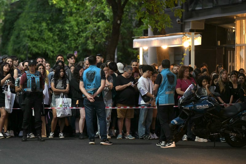 Fans of British singer Liam Payne wait near the hotel where he died in Buenos Aires on October 16, 2024. Photograph: Juan Mabromata/AFP via Getty Images)