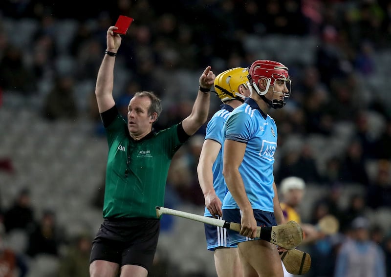 Johnny Murphy shows Dublin's Eoghan O'Donnell a red card – one of three he issued on the night, along with 13 yellows – in a Dublin vs Wexford hurling league clash at Croke Park in 2020. Photograph: Bryan Keane/Inpho