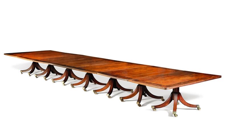 Irish Regency rosewood banded mahogany seven pedestal dining table, from Carton House