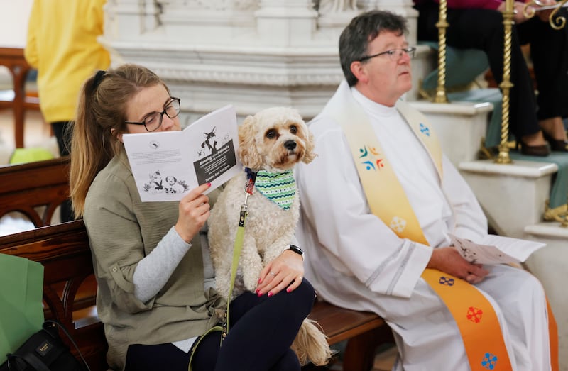 Sarah McCann with her dog Dougal at St Columba’s Church where Fr Joseph Ryan performed a Blessing of the Animals service. Photograph: Alan Betson
