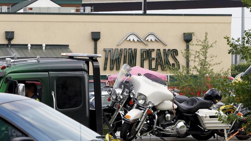 A motorcycle being removed from the Twin Peaks restaurant, where nine members of a motorcycle gang were shot and killed in Waco, Texas, on Sunday. Photograph: Mike Stone/Reuters