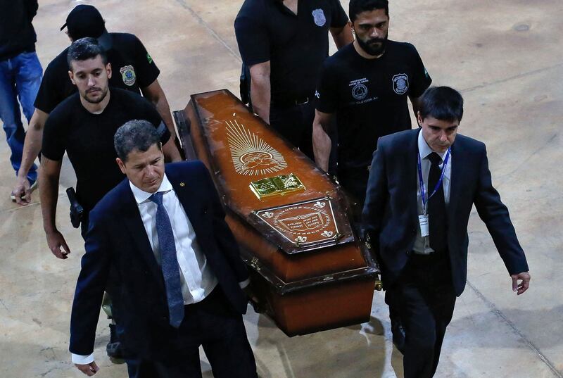 One of the coffins containing human remains found during the search for missing British journalist Dom Phillips and indigenous expert Bruno Pereira in the Amazon forest, is carried upon arrival at the Federal Police hangar in Braszil on June 16th. Photograph: Sergio Lima/AFP via Getty Images