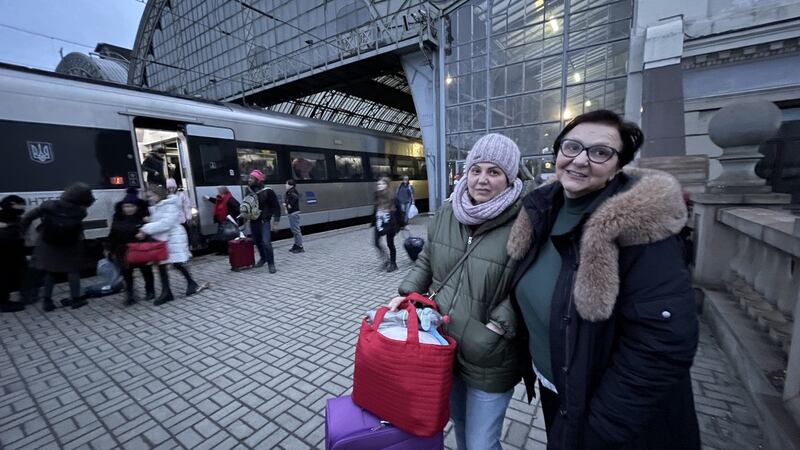 Alina Kosse (right), head of a youth arts centre in eastern Ukraine with sister Marina after fleeing from Kyiv to Lviv on an evacuation train. Photograph: Daniel McLaughlin