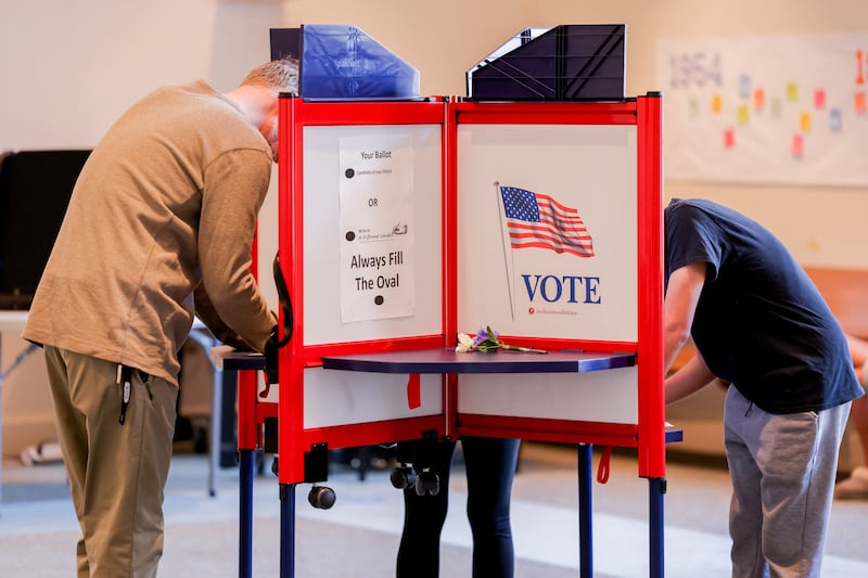 Voters cast their ballots at a polling location in Fairfax, Virginia. Photograph: ALI KHALIGH/Middle East Images/AFP via Getty Images