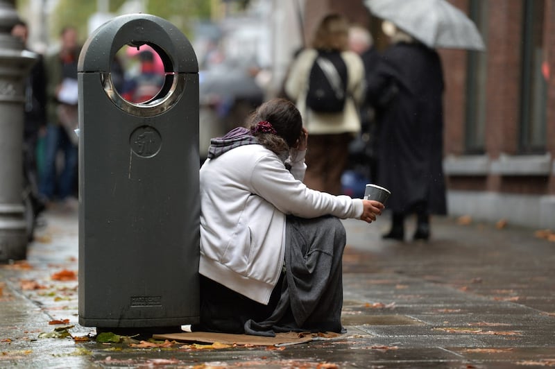 A young woman with a paper cup begging in Dublin city centre. 



photograph: cyril byrne