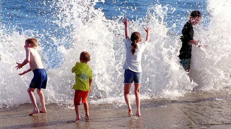 Childern cooling off in the surf on Tramore beach Co Waterford. Photograph: David Sleator