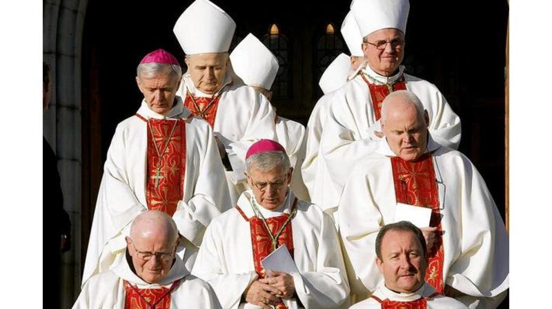 Bishops and clergy emerge following the Requiem Mass at St Patricks Cathedral, Armagh, including Bishop John Fleming of Killala (top left), Bishop Leo OReilly of Kilmore (second from top left), Auxiliary Bishop of Derry Francis Lagan (centre with head down) and Liam Bergin, rector of the Irish College in Rome (bottom right);