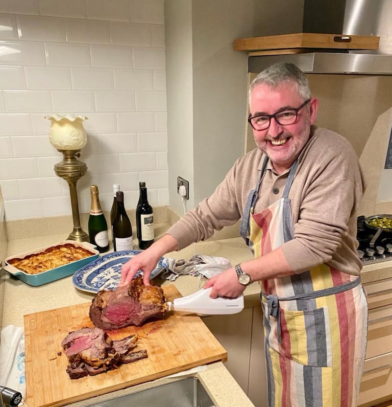 Declan Maxwell with his prized electric carving knife, which has become 'a bit of a tradition'