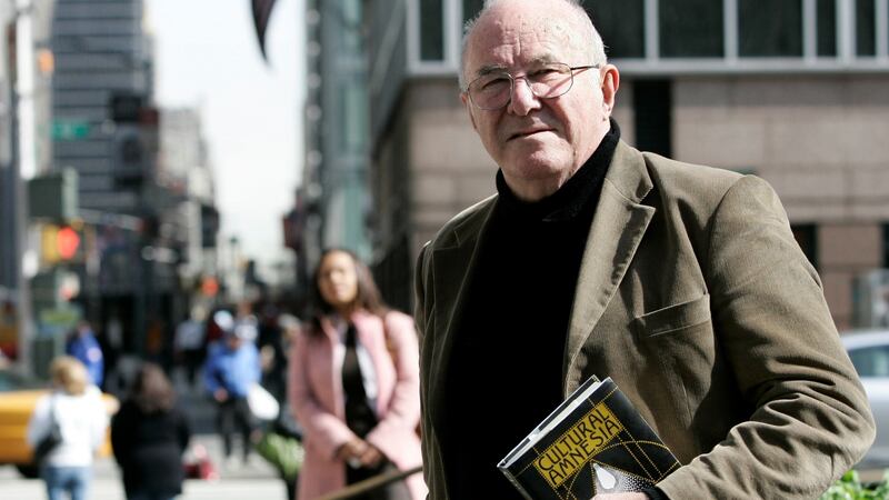 Clive James in New York holding a copy of his book Cultural Amnesia in March 2007.  Photograph: Shannon Stapleton/Reuters