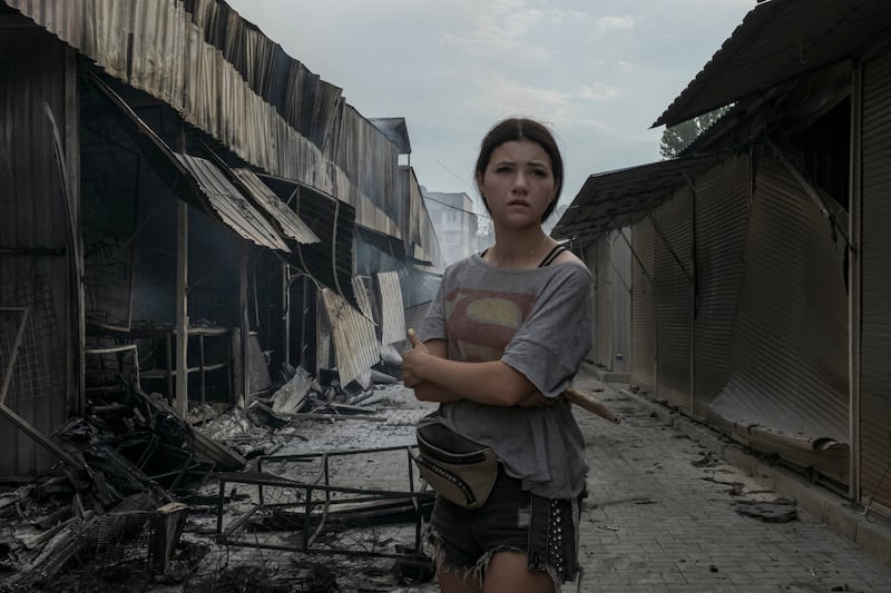 A young woman stands amid stalls destroyed by shelling at a market in Sloviansk, in eastern Ukraine, July 5th. Photograph: Mauricio Lima/The New York Times