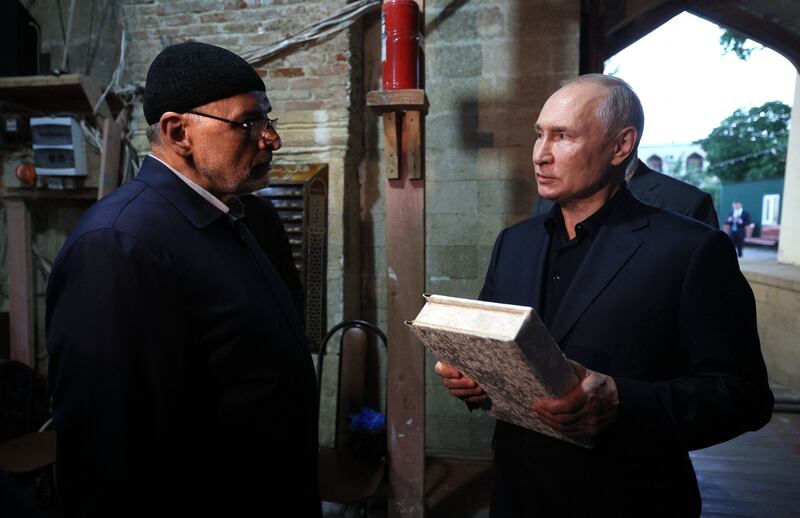 Russian president Vladimir Putin visits the Juma Mosque in Derbent in Russia's Republic of Dagestan on Wednesday. Photograph: Gavriil Grigorov/Sputnik/AFP via Getty Images