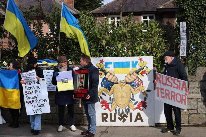 A line of protesters outside the Russian embassy. Photograph: Dara Mac Dónaill