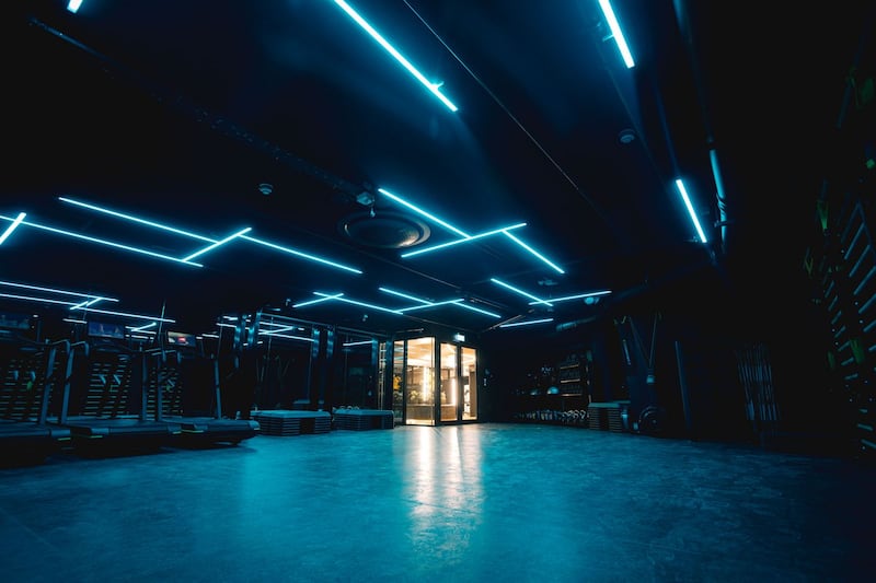 First look: Studio with treadmills, softly lit by neon strips