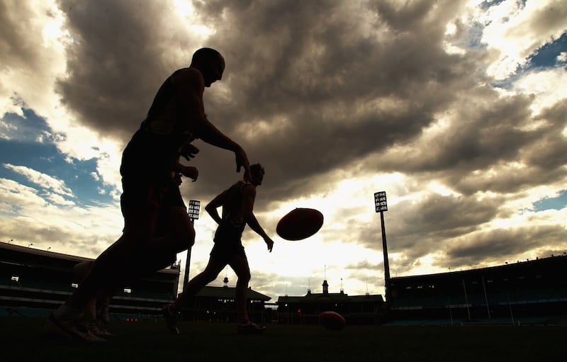 Tadhg Kennelly runs laps with Jude Bolton during a Sydney Swans training session at Sydney Cricket Ground in September 2010. Photograph: Ryan Pierse/Getty Images