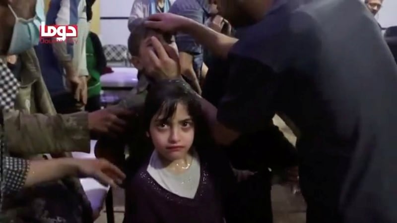 A girl looks on following an alleged chemical weapons attack, in what is said to be Douma, Syria in this still image from a video. Photograph: White Helmets/Reuters TV