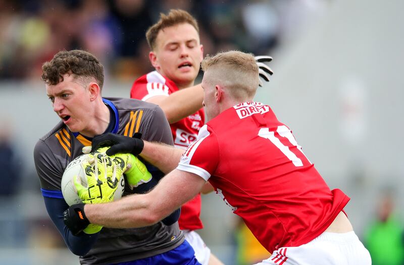 Clare goalkeeper Stephen Ryan with John O'Rourke and Luke Fahy of Cork. Photograph: Natasha Barton/Inpho