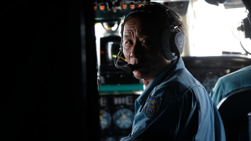 A military personnel communicates with his colleagues by radio during a search and rescue mission onboard an aircraft belonging to the Vietnamese airforce off Vietnam’s Tho Chu island. Photograph: Kham/Reuters