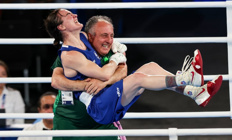 Kellie Harrington celebrates winning gold at the Paris Olympics with coach Zaur Antia. Photograph: Ryan Byrne/Inpho