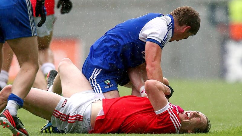 Monaghan’s Dessie Mone gets to grips with Colm Cavanagh of Tyrone. Photograph: Ryan Byrne/Inpho