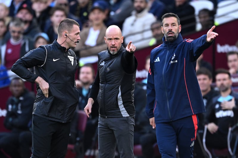 Erik ten Hag, then Manchester United manager, and Ruud van Nistelrooy react during Sunday's loss at West Ham. Photograph: Justin Setterfield/Getty