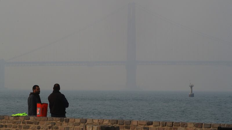 The Golden Gate Bridge is shrouded in smoke from the Camp Fire that has settled over the San Francisco Bay. Photograph: Jim Wilson/The New York Times.