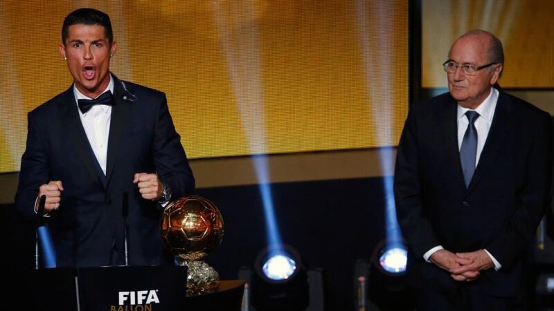 Real Madrid and Portugal forward Cristiano Ronaldo  after receiving the Fifa Ballon d’Or award from Fifa President Joseph Blatter. Photograph: Ruben Sprich / Reuters