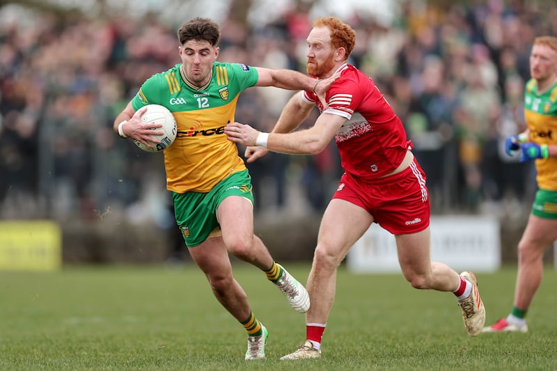 Donegal's Daire Ó Baoill in action against Derry's Conor Glass. Photograph: Laszlo Geczo/Inpho