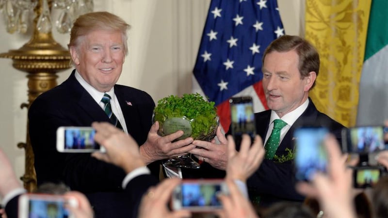 Donald Trump accepts a bowl of shamrock from Enda Kenny at the White House in 2017. Photograph: Olivier Douliery/EPA