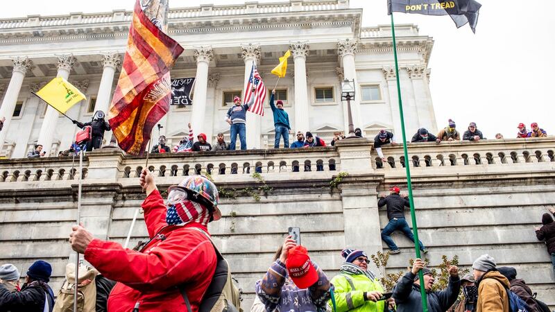 A mob allegedly incited by President Donald Trump storms the Senate side of the US  Capitol in Washington DC last January. Photograph: Jason Andrew/The New York Times