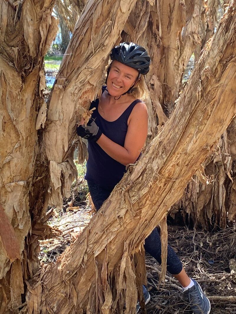 Gill Kenny among some paperbark trees in Western Australia