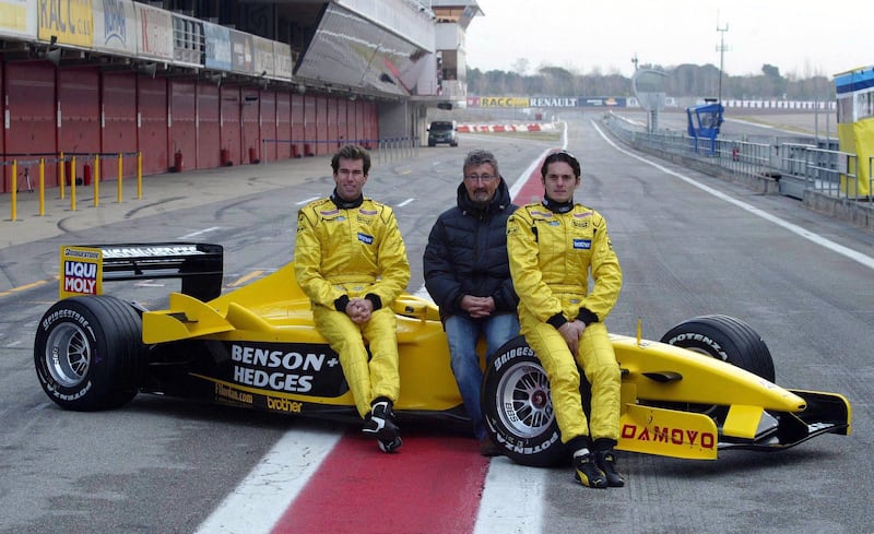 Eddie Jordan with drivers Ralph Firman Jnr (left) and Giancarlo Fisichella (right) during testing at Barcelona's Circuit de Catalunya in February 2003. Photograph: Inpho/Getty Images