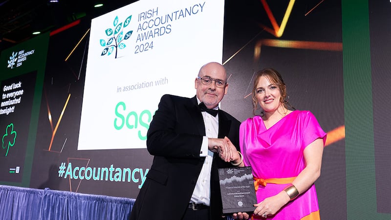 Alan Connor, managing director, Iplicit Ireland, presents the finance director of the year award to Elaine Grace, Lidl Ireland & Northern Ireland