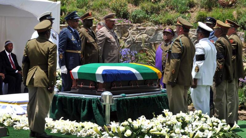 The coffin of former South African President Nelson Mandela is prepared to be buried during his funeral ceremony in Qunu, Eastern Cape. Photograph: South African Government Communication and Information System (GCIS)/Reuters