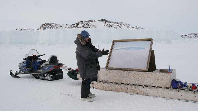 Danny Osborne paints on the sea ice