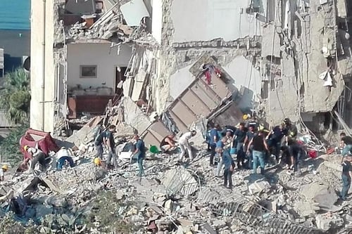 Apartment block in Italy collapses trapping up to seven people